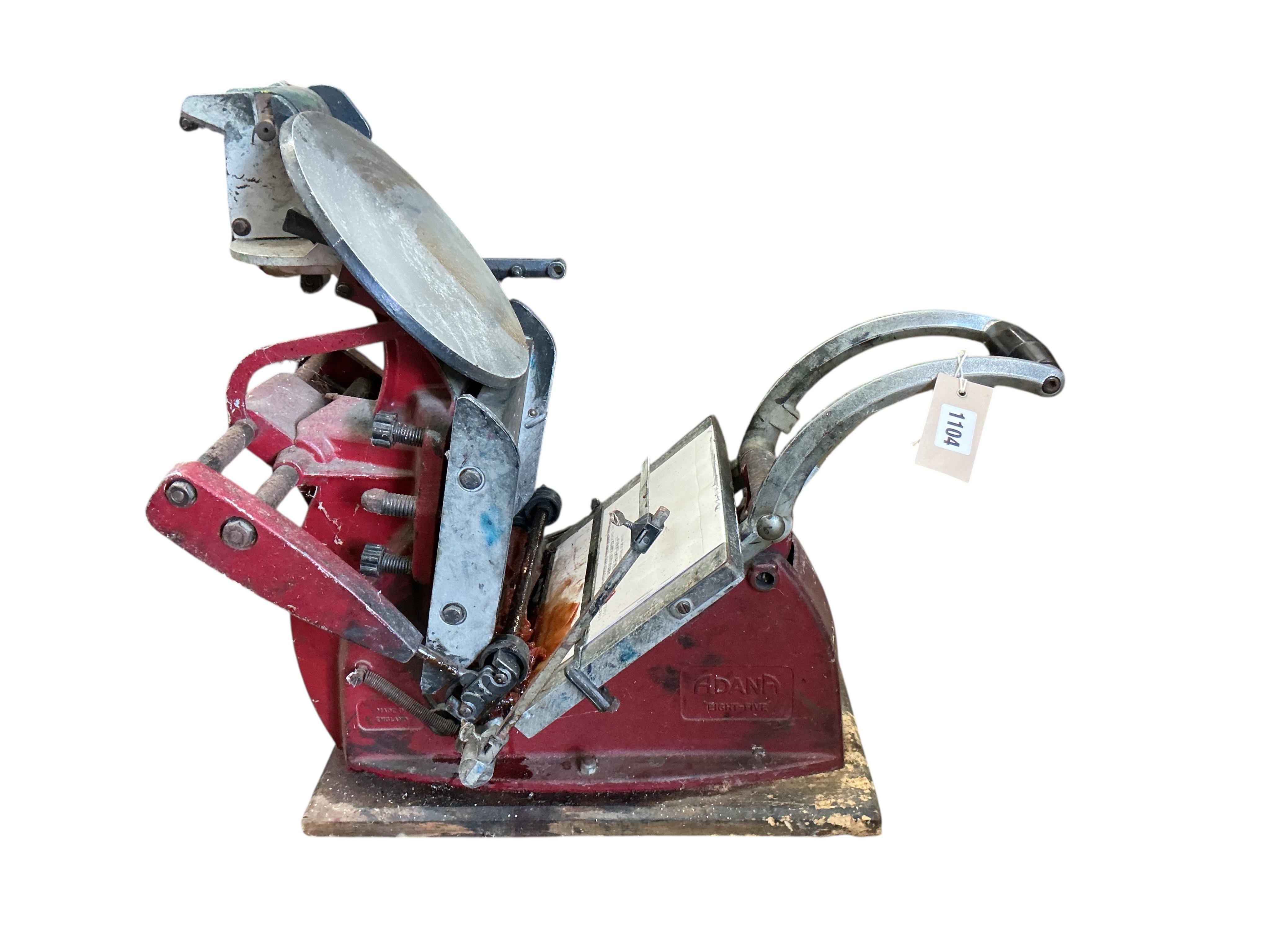 An Adana eight-five printing press with a large quantity of assorted type face, trays, accessories etc.